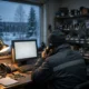A worker seen from behind at a desk in a small industrial supply office at dusk, holding a telephone receiver to their ear, a computer screen glowing blank with no readable text, shelves of industrial parts blurred in the background, in cold blue-grey tones with a single warm desk lamp, no brand logos, no readable text.